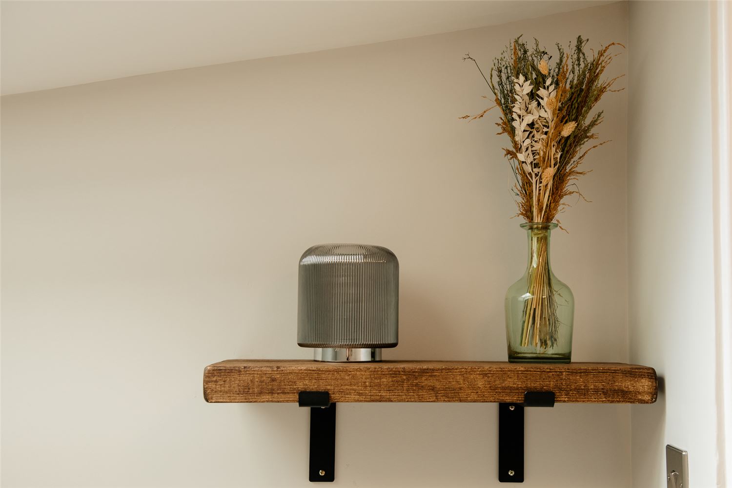 shelf with lamp and flowers isle of bute accommodation